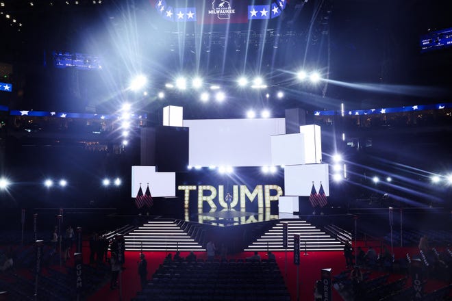 A Trump sign is illuminated ahead of Day 3 of the Republican National Convention (RNC), at the Fiserv Forum in Milwaukee, Wisconsin on July 17, 2024.