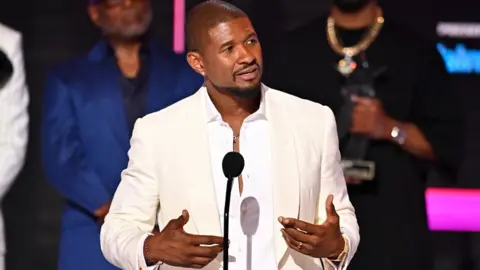 Getty Images Honoree Usher accepts the Lifetime Achievement Award onstage during the 2024 BET Awards at Peacock Theater on June 30, 2024 in Los Angeles, California.