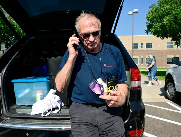 Quarry Fire evacuee John Banks answers a phone call from the evacuation center at Dakota Ridge High School in Jefferson County on Wednesday, July 31, 2024. Banks and his wife and cat had to evacuate from the Watson Gulch area early Wednesday morning. (Photo by Andy Cross/ The Denver Post)