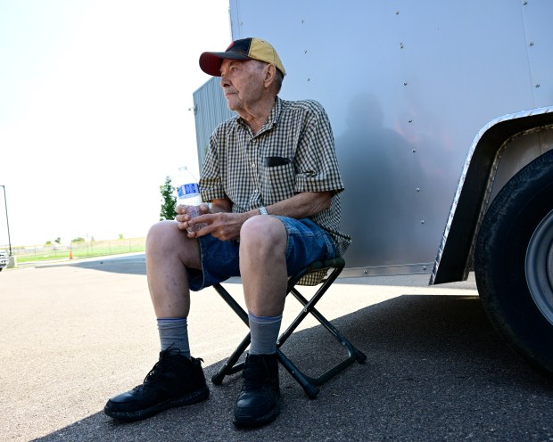 Quarry Fire evacuee Elden Coombs waits in the shade at the evacuation center at Dakota Ridge High School in Jefferson County on Wednesday, July 31, 2024. Coombs had to evacuate from the Homewood Park area. (Photo by Andy Cross/ The Denver Post)