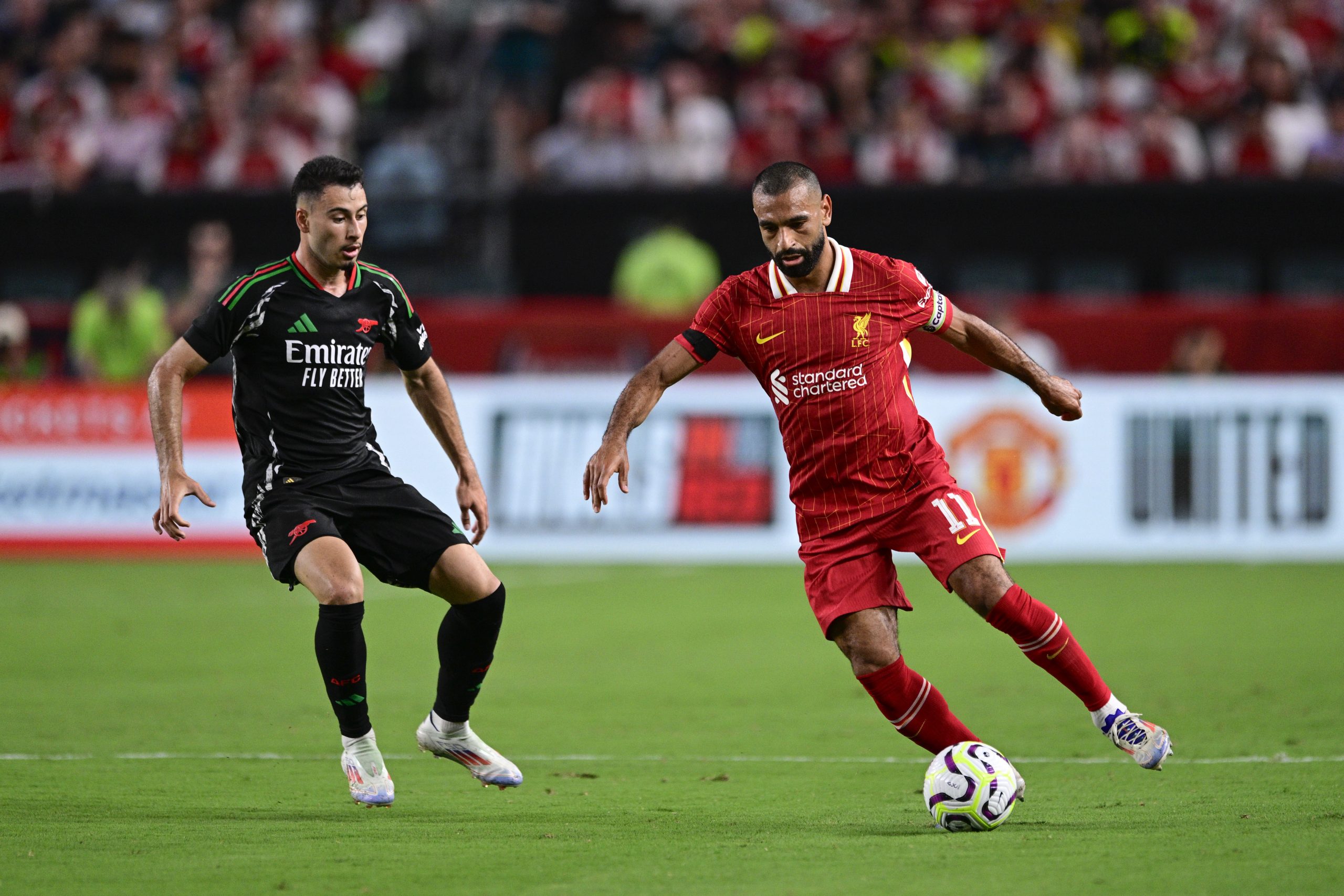 A record soccer crowd sees Liverpool win exhibition at the Linc