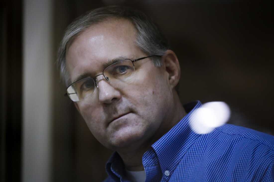 Paul Whelan looks through a cage's glass in a courtroom in Moscow on Jan. 22, 2019.