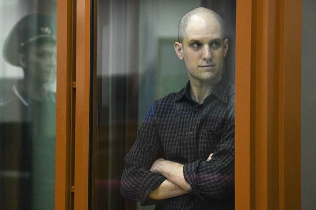 Wall Street Journal reporter Evan Gershkovich stands in a glass defendant's booth in a courtroom in Yekaterinburg, Russia, on June 26.