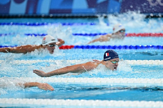 France's Léon Marchand leads the 200-meter butterfly final on July 31. Marchand won the event and then came back to the pool later in the night to win gold in the 200-meter breaststroke. He set Olympic records in both.