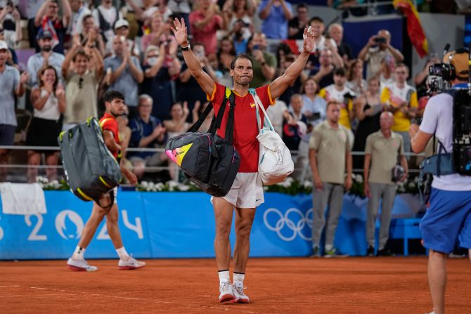 Spain's Rafael Nadal waves goodbye after he and doubles partner Carlos Alcaraz were knocked out in the quarterfinals by the United States' Austin Krajicek and Rajeev Ram on July 31. Nadal’s future in tennis is uncertain as injuries continue to plague him.