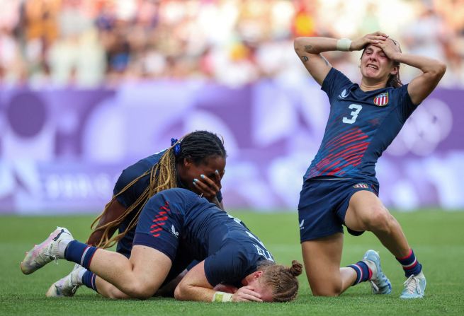 The United States' Naya Tapper, Alev Kelter and Kayla Canett celebrate after their team finished a stunning comeback to defeat Australia and win bronze in rugby sevens on July 30. It is the the United States' first-ever Olympic medal in the sport — for either men or women.