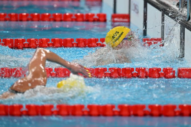 Mollie O'Callaghan beats fellow Australian Ariarne Titmus to the wall to win the 200-meter freestyle on July 29. O'Callaghan finished in 1:53.27, topping Titmus’ Olympic record from three years ago. Titmus won the silver.