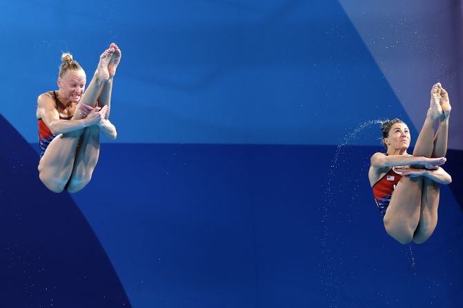 US divers Sarah Bacon, left, and Kassidy Cook compete in the synchronized 3-meter springboard event on July 27. They earned silver — the United States’ first medal of this year's Games. The gold went to China's Chang Yani and Chen Yiwen.