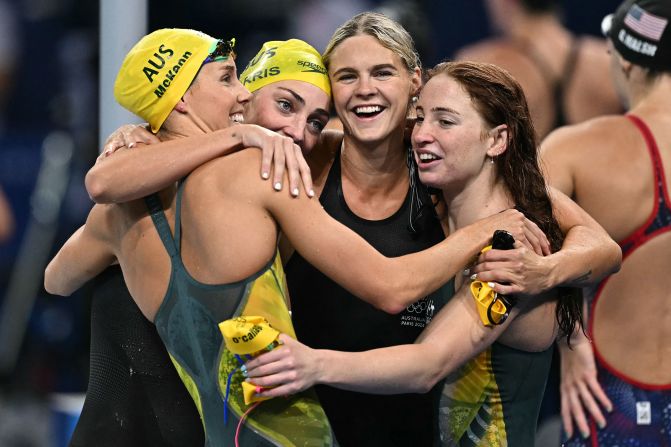 Australia's Emma McKeon, Meg Harris, Shayna Jack and Mollie O'Callaghan celebrate after winning the women's 4x100-meter freestyle relay on July 27. The team set an Olympic record with a time of 3:28:92.