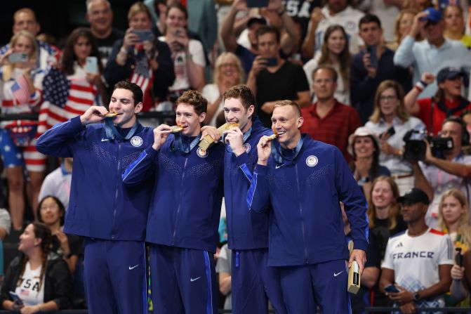 Swimmers Jack Alexy, Chris Guiliano, Hunter Armstrong and Caeleb Dressel celebrate on July 27 after winning the men's 4x100-meter freestyle relay and claiming the United States' first gold medal of the Paris Olympics. The result also continued Dressel’s streak of winning gold in every Olympic race in which he’s competed. He won five gold medals in Tokyo.