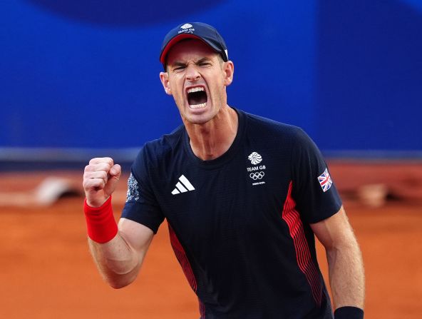 Great Britain’s Andy Murray reacts after he and doubles partner Dan Evans came back to defeat Japan’s Taro Daniel and Kei Nishikori in a second-round match at the Olympics on July 28. They fought off five match points to win 2-6, 7-6, 11-9. Murray has said he will retire after the Games.