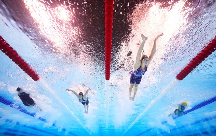 US swimmer Gretchen Walsh, second from right, set a new Olympic record in the 100-meter butterfly during a semifinal race on July 27. She finished in 55.38 seconds.