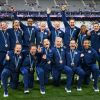 Team USA celebrates with their bronze medals during the victory ceremony during the Paris 2024 Olympic Games at the Stade de France in Saint-Denis on Tuesday.