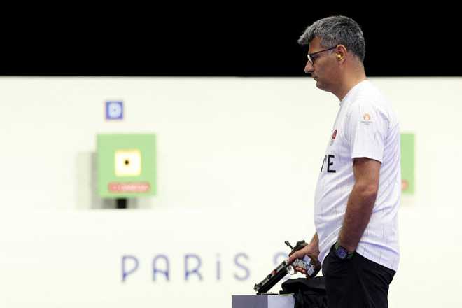 Turkey's Yusuf Dikec competes in the shooting 10m air pistol mixed team gold medal match during the Paris 2024 Olympic Games at Chateauroux Shooting Centre on July 30, 2024. (Photo by Alain JOCARD / AFP) (Photo by ALAIN JOCARD/AFP via Getty Images)