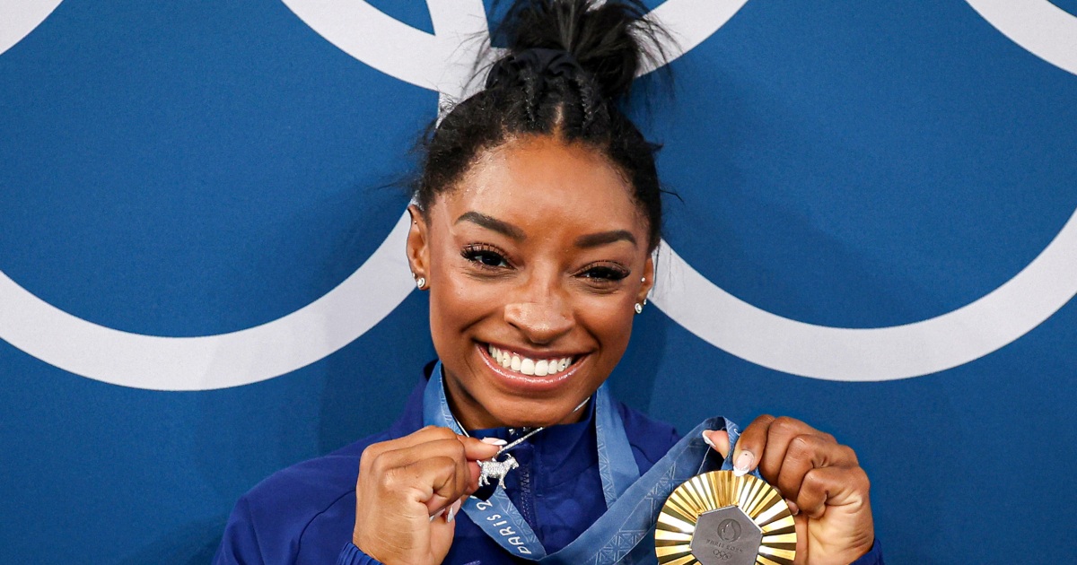 Simone Biles says she knew people would 'go crazy over' her 'GOAT' necklace