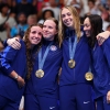 Gold Medalists (from left to right) Regan Smith, Lilly King, Gretchen Walsh and Torri Huske of Team United States celebrate on the podium during the medal ceremony after the Women’s 4x100m Medley Relay Final on Sunday at the Paris Olympics.