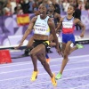 Julien Alfred, of St. Lucia, celebrates after winning the women's 100-meters final at the Paris Olympics, Saturday, Aug. 3, 2024, in Saint-Denis, France.