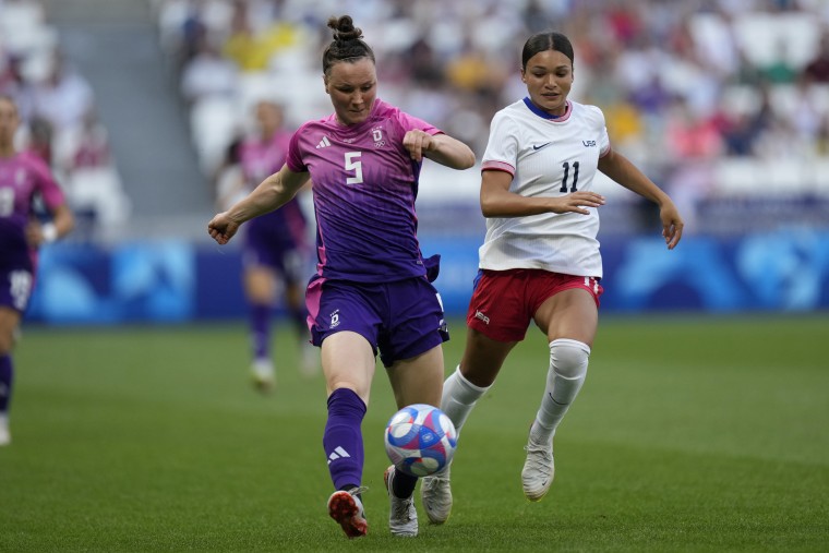 Germany's Marina Hegering fights for the ball with Sophia Smith of the U.S. 