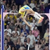 Armand Duplantis, of Sweden, clears the bar at 6.25 to set a new world record during the men's pole vault final at the 2024 Summer Olympics on Monday in Saint-Denis, France.