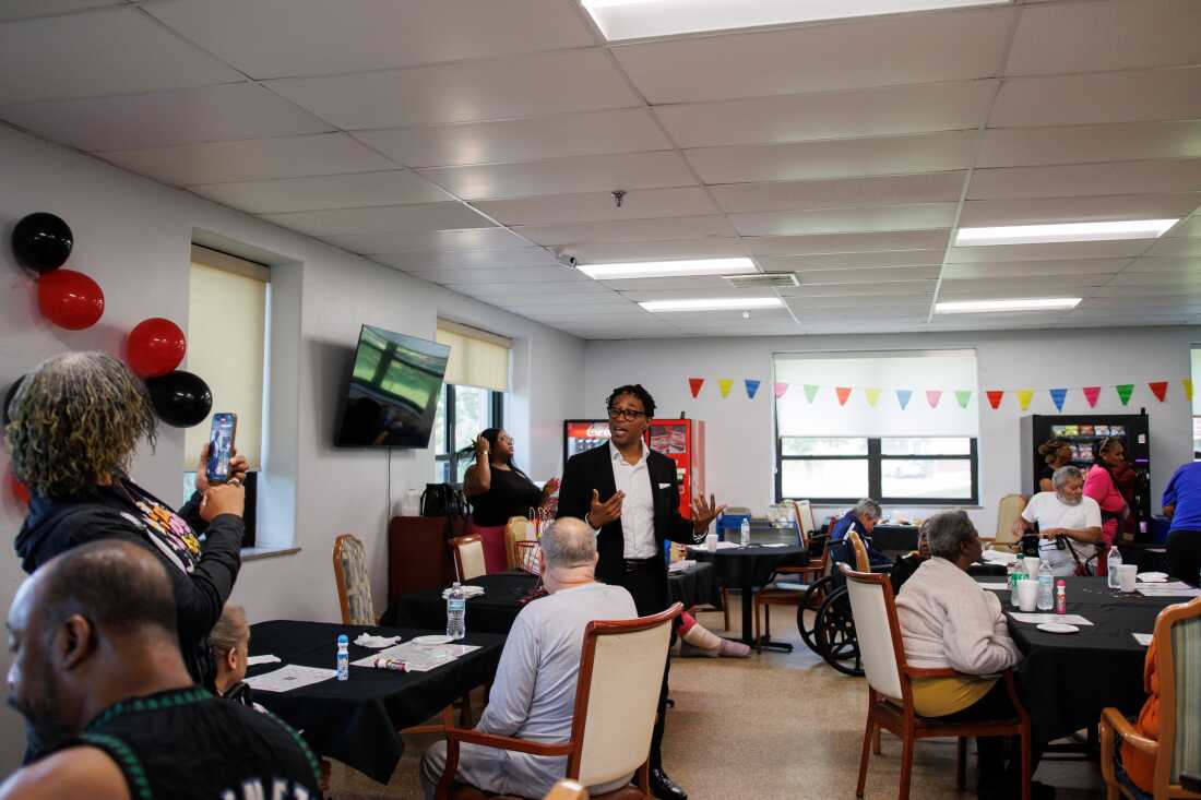 Wesley Bell introduces himself before bingo starts at the Normandy Nursing Center in Normandy, Mo., on July 25.