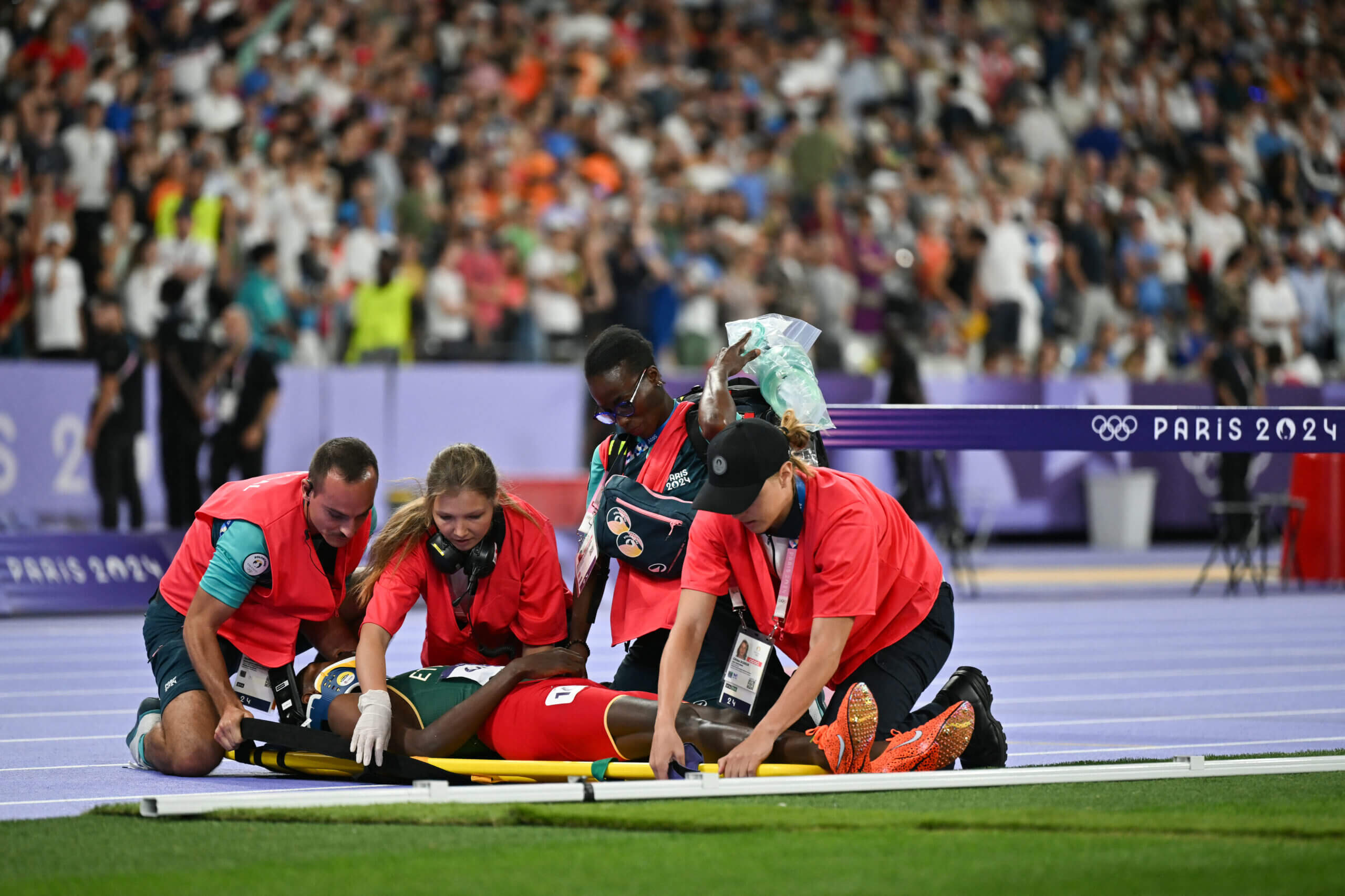 Ethiopia’s Lamecha Girma stretchered off track after falling during steeplechase final