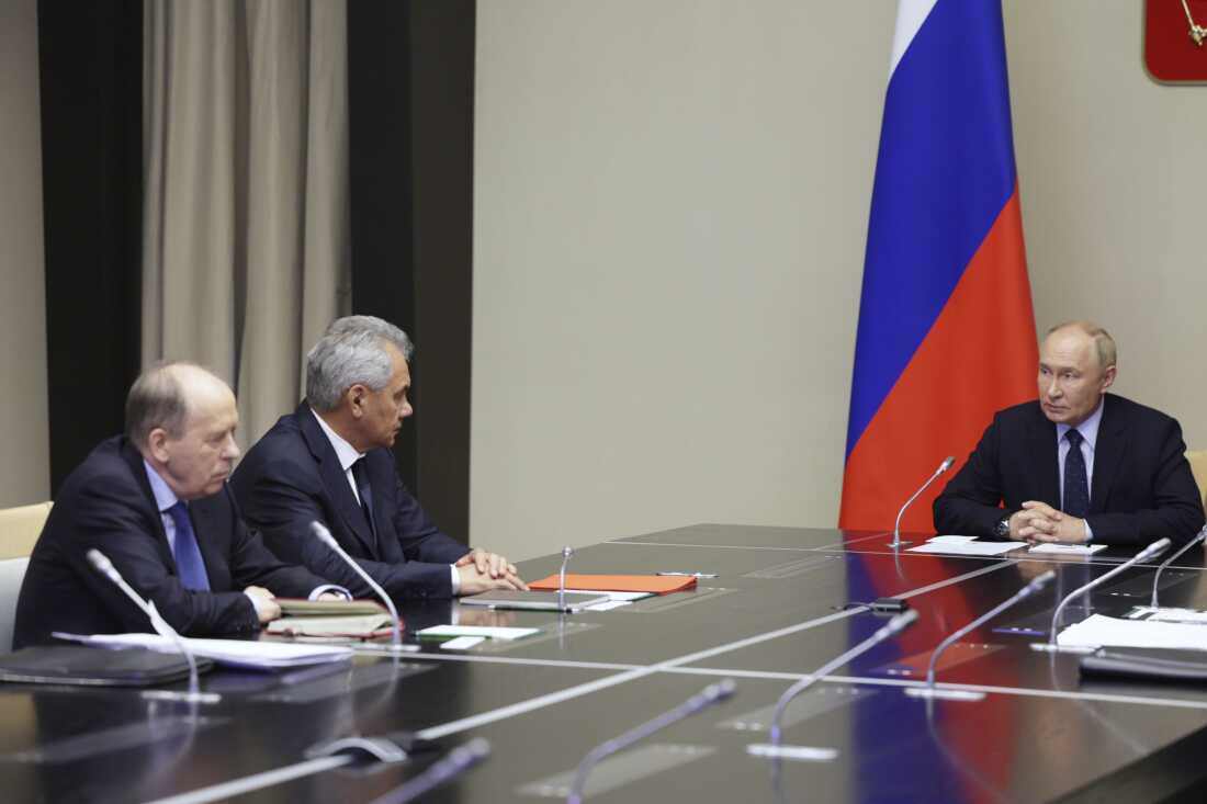 Russian President Vladimir Putin (right) chairs a meeting with top security officials Wednesday to discuss the Ukrainian military incursion in western Russia.