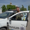 Oleksii Kharkivskyi, the chief of the patrol police of Vovchansk, in his police car in an undisclosed location in Kharkiv Oblast, Ukraine, on May 26.