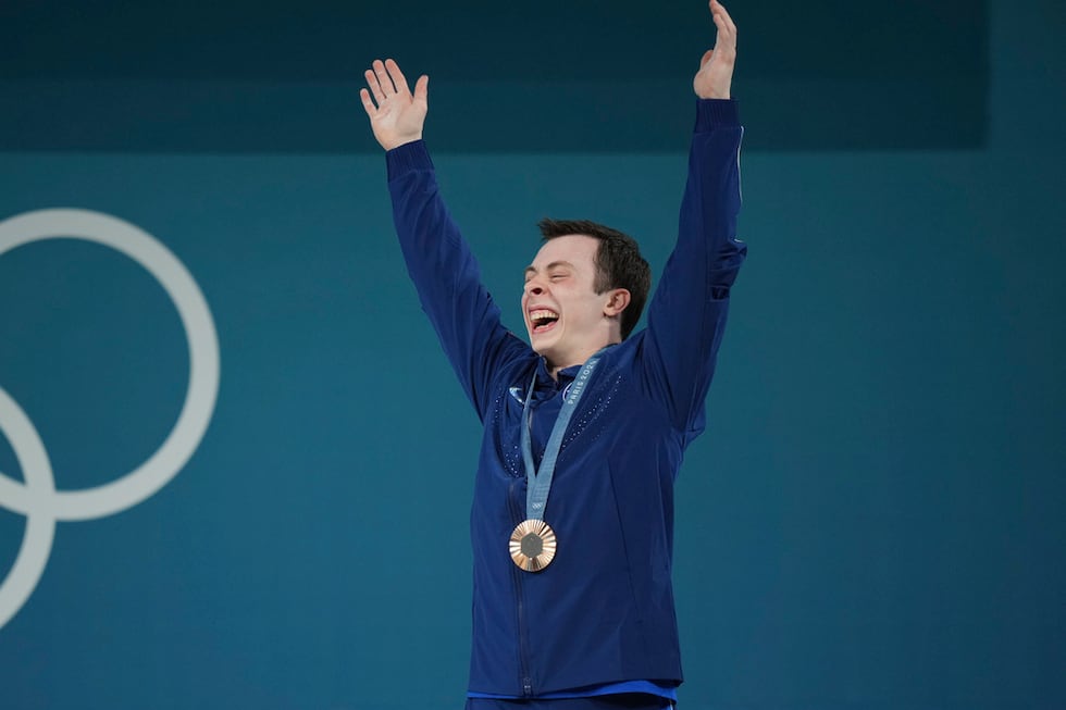 Bronze medalist Hampton Morris of the United States celebrates on the podium during the medal...