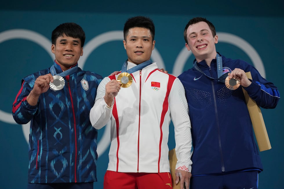 Medalist, from left to right, Theerapong Silachai of Thailand, silver, Li Fabin of China,...