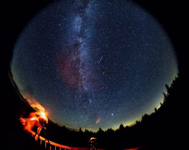 In this 30 second exposure taken with a circular fish-eye lens, a meteor streaks across the sky during the annual Perseid meteor shower on Friday, Aug. 12, 2016 in Spruce Knob, West Virginia. Photo Credit: (NASA/Bill Ingalls)