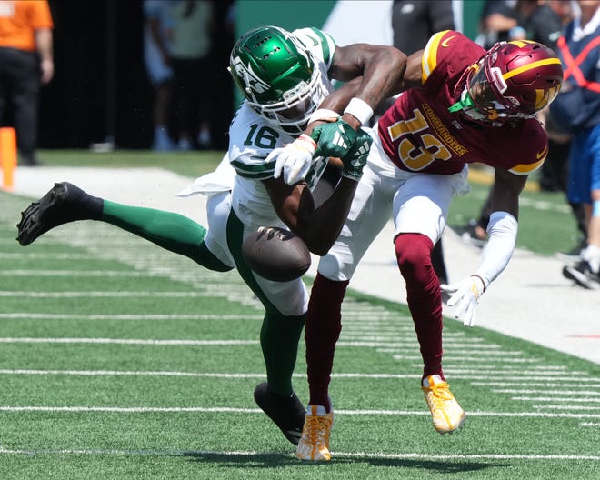 East Rutherford, NJ -- August 10, 2024 -- Jason Brownlee of the Jets has this pass broken up by Byron Pringle of the Commanders as the Washington Commanders came to MetLife Stadium to play the New York Jets in the first press season game of the 2024 season.