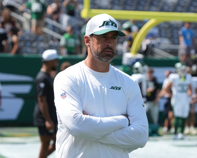 East Rutherford, NJ -- August 10, 2024 -- Aaron Rodgers, who wasnÕt dressed to play, during pre game warm ups as the Washington Commanders came to MetLife Stadium to play the New York Jets in the first press season game of the 2024 season.