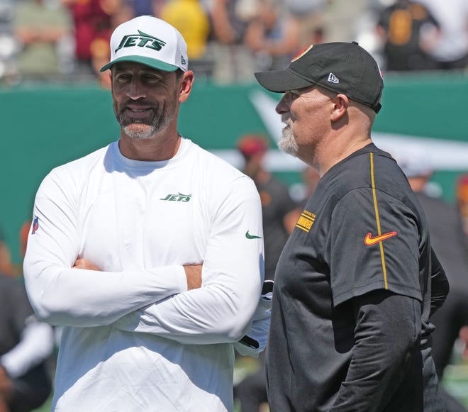 East Rutherford, NJ -- August 10, 2024 -- Aaron Rodgers with Washington head coach Dan Quinn during pre game warm ups as the Washington Commanders came to MetLife Stadium to play the New York Jets in the first press season game of the 2024 season.