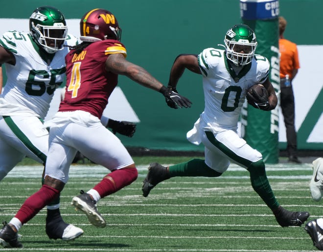 East Rutherford, NJ -- August 10, 2024 -- Running the ball in the first half is Braylon Allen of the Jets as the Washington Commanders came to MetLife Stadium to play the New York Jets in the first press season game of the 2024 season.