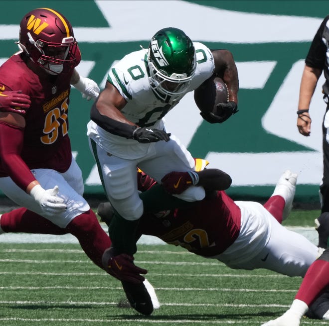 East Rutherford, NJ -- August 10, 2024 -- Running the ball in the first half is Braylon Allen of the Jets as the Washington Commanders came to MetLife Stadium to play the New York Jets in the first press season game of the 2024 season.