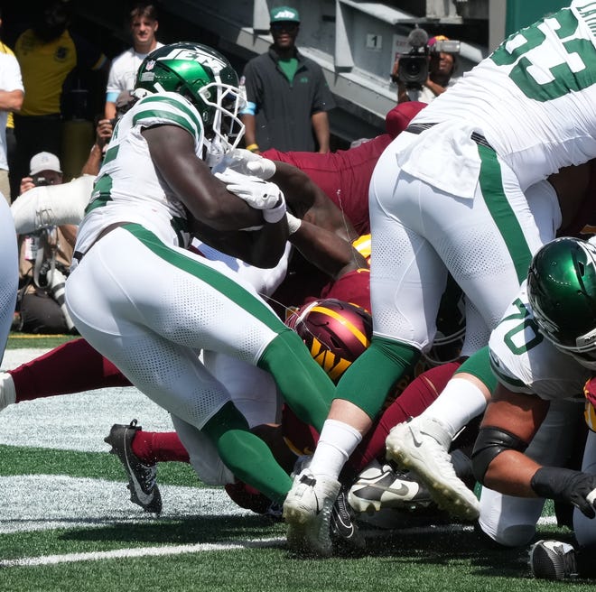 East Rutherford, NJ -- August 10, 2024 -- Jets running back Israel Abanikanda scores the tying TD in the second half as the Washington Commanders came to MetLife Stadium to play the New York Jets in the first press season game of the 2024 season. The Jets topped the Commanders 20-17.