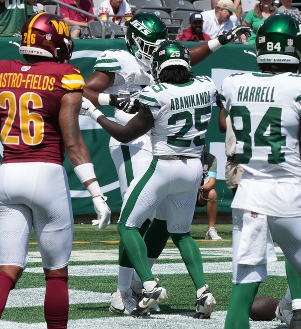 East Rutherford, NJ -- August 10, 2024 -- Jets running back Israel Abanikanda scores the tying TD in the second half as the Washington Commanders came to MetLife Stadium to play the New York Jets in the first press season game of the 2024 season. The Jets topped the Commanders 20-17.