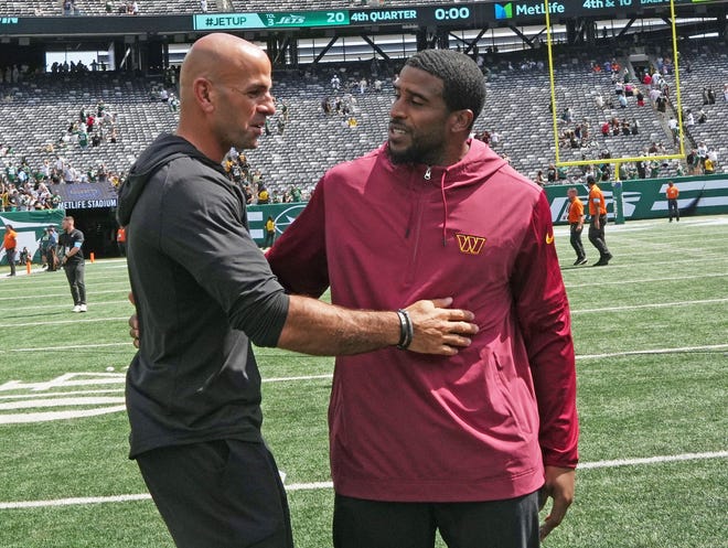 East Rutherford, NJ -- August 10, 2024 -- Head coach Robert Salih and former Seahawks linebacker now with the Commanders, Bobby Wagner at the end of the game as the Washington Commanders came to MetLife Stadium to play the New York Jets in the first press season game of the 2024 season. The Jets topped the Commanders 20-17.