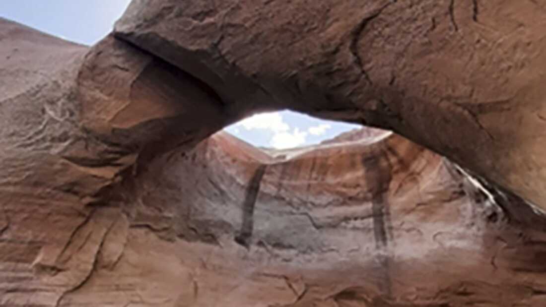 This undated photo provided by the National Park Service shows Double Arch before it collapsed in Rock Creek Bay, part of the Glen Canyon National Recreation Area in Utah, last week.