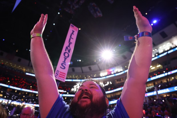 Delegates cheer as Gov. JB Pritzker announces the Illinois delegation...