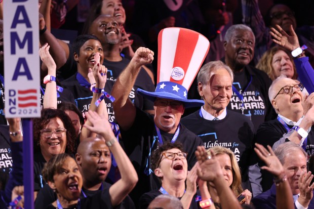 People in the crowd dance at the Democratic National Convention...