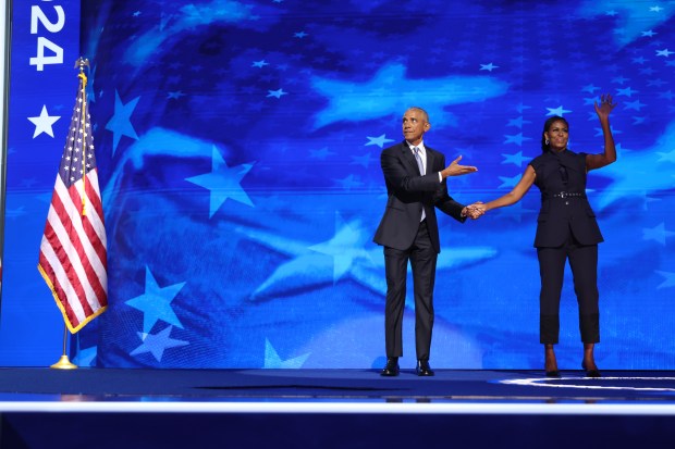 Former first lady Michelle Obama introduces former President Barack Obama,...