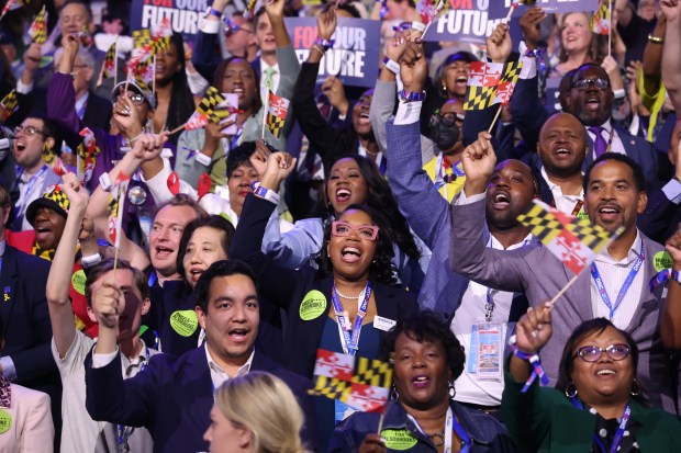 Maryland delegates react to speakers, Aug. 20, 2024, during the...