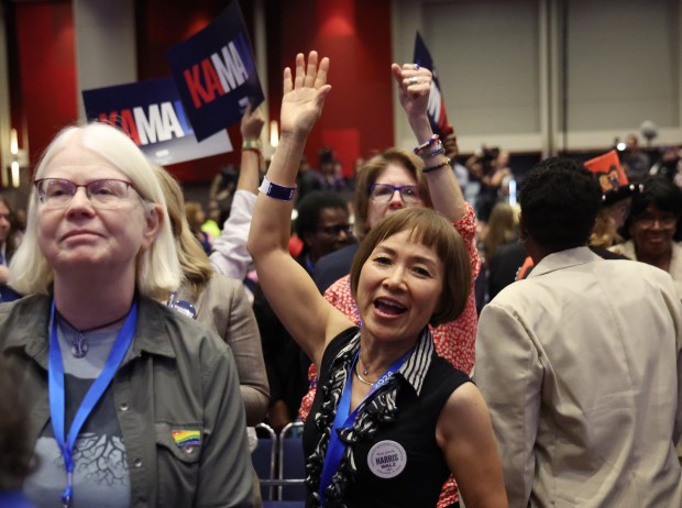 Delegates cheer “USA” during Democratic vice presidential nominee Minnesota Gov....