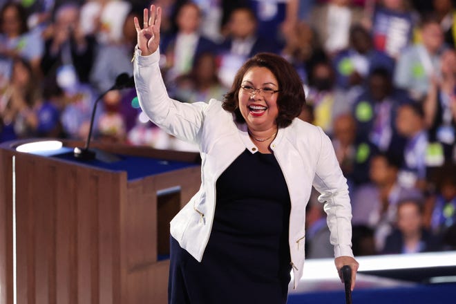 U.S. Senator Tammy Duckworth (D-IL) waves to the audience on Day 2 of the Democratic National Convention (DNC) in Chicago, Illinois, U.S., August 20, 2024. REUTERS/Brendan Mcdermid