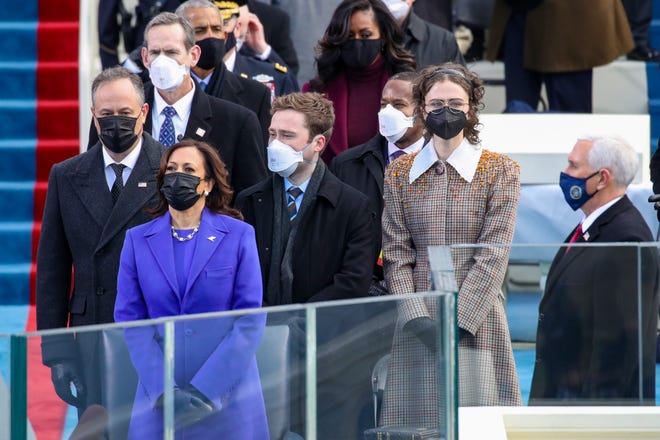 WASHINGTON, DC - JANUARY 20: Doug Emhoff (from left), Vice President Elect Kamala Harris, Cole Emhoff, Ella Emhoff, and Vice President Mike Pence stand as Lady Gaga sings the National Anthem at the inauguration of U.S. President-elect Joe Biden on the West Front of the U.S. Capitol on January 20, 2021 in Washington, DC. During today's inauguration ceremony Joe Biden becomes the 46th president of the United States. (Photo by Win McNamee/Getty Images)