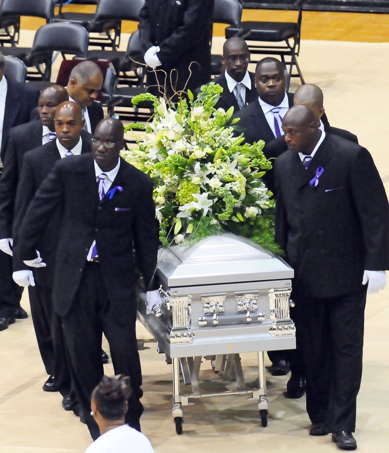 Pall bearers arrive with the casket for a funeral service for Steve McNair.