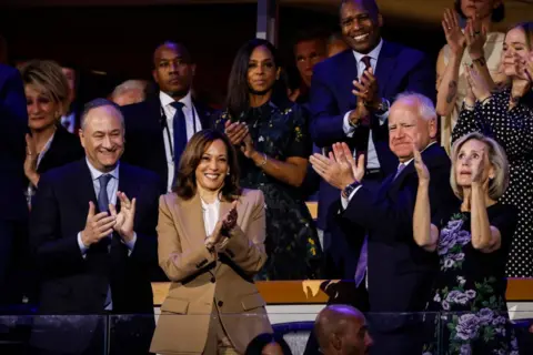 Getty Images Doug Emhoff, Kamala Harris, Tim Walz and Gwen Walz at the DNC