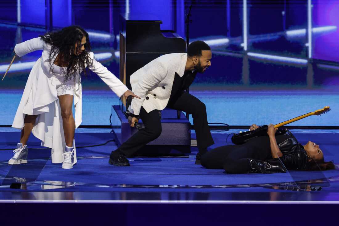 Musicians John Legend and Sheila E. perform on stage during the third day of the Democratic National Convention in Chicago, Illinois.