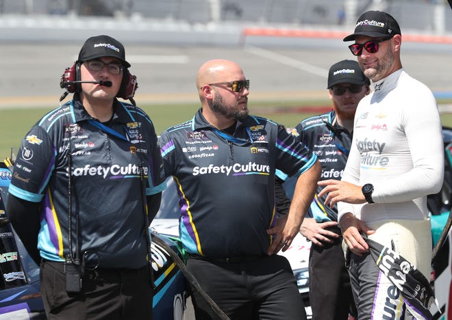 Shane van Gisbergen stands with the crew as they work the No. 97 Chevrolet down the line during Xfinity Series qualifying, Friday, Aug. 23, 2024, at Daytona International Speedway.